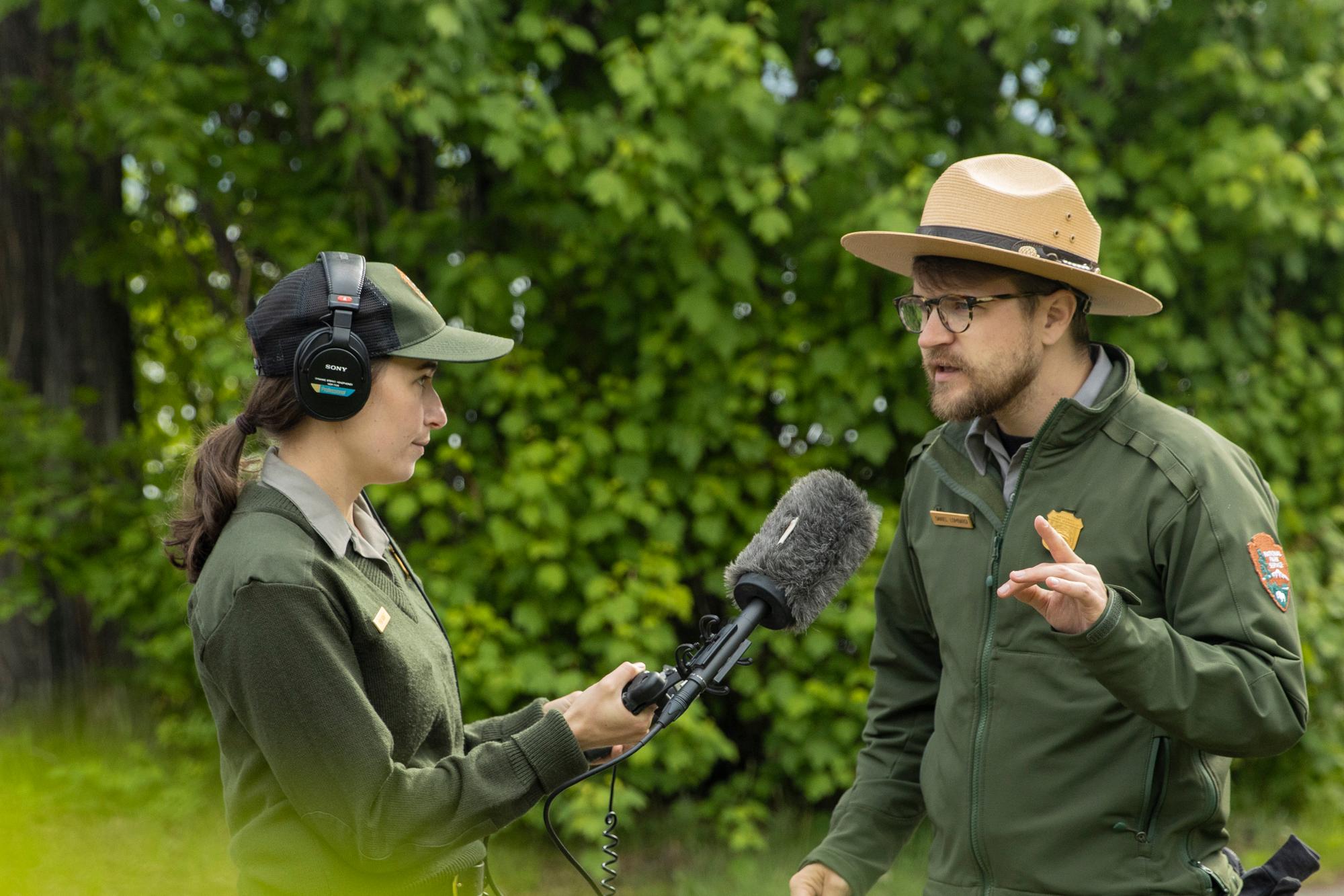 Two rangers talk in uniform